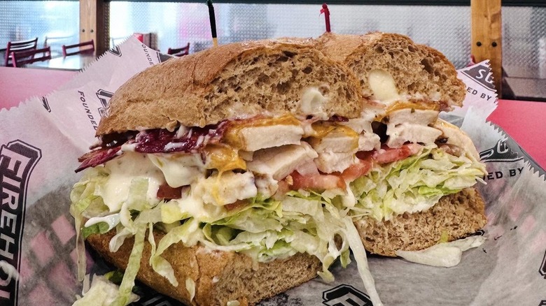 cross section of a Firehouse Subs Chicken 'N' Cheddar Rancher on brown bread