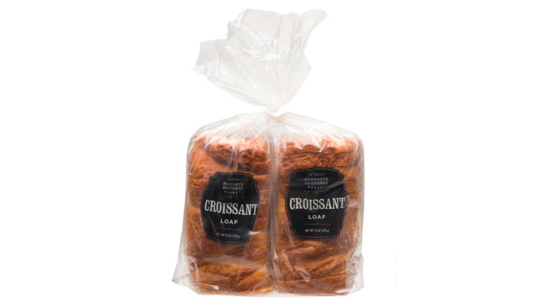 Two Schwartz Brothers Bakery croissant loaves in clear plastic bag