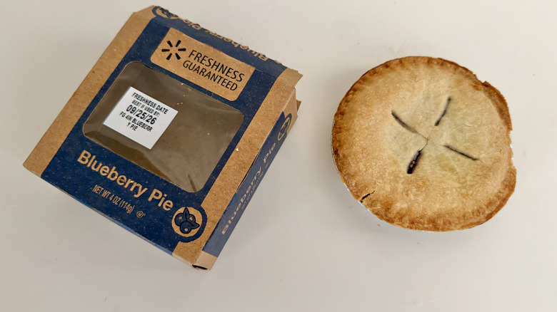 Freshness Guaranteed Mini Blueberry Pie on a table