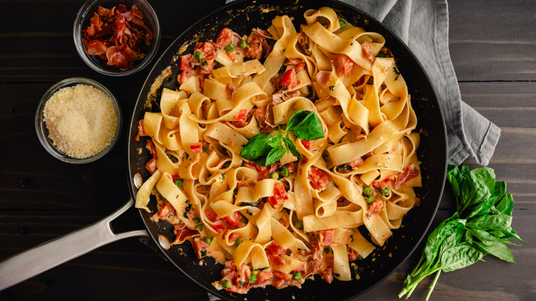 parpadelle with prosciutto in skillet