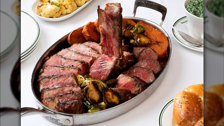 Stainless steel platter with sliced wagyu porterhouse from Smith & Wollensky