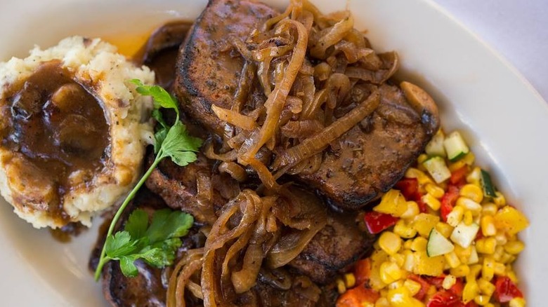 Plate of Cheesecake Factory Meatloaf with mashed potatoes and corn