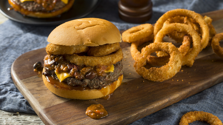 Homemade Barbecue Chili Cheeseburger with Onion Rings.