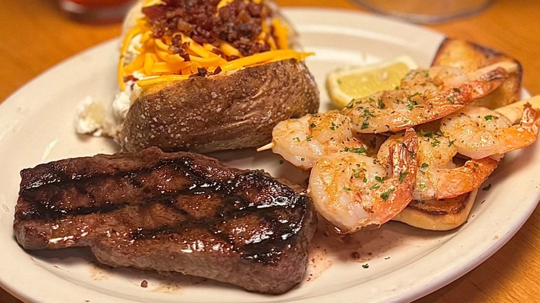 Ribeye and grilled shrimp on a plate