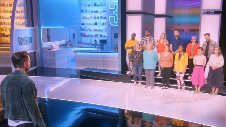 Joel McHale with contestants in Crime Scene Kitchen