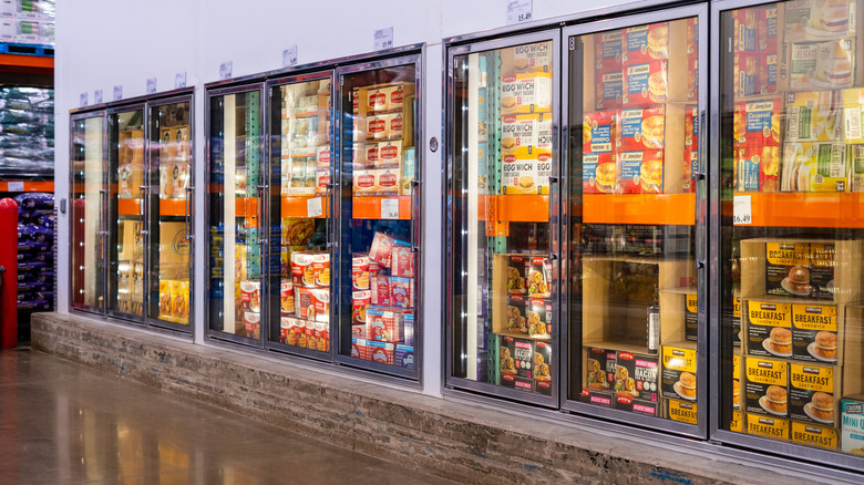 Costco frozen aisle showing freezers full of breakfast sandwich products