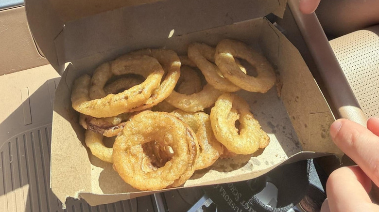 A cardboard box of stale onion rings from Burger King Canada.