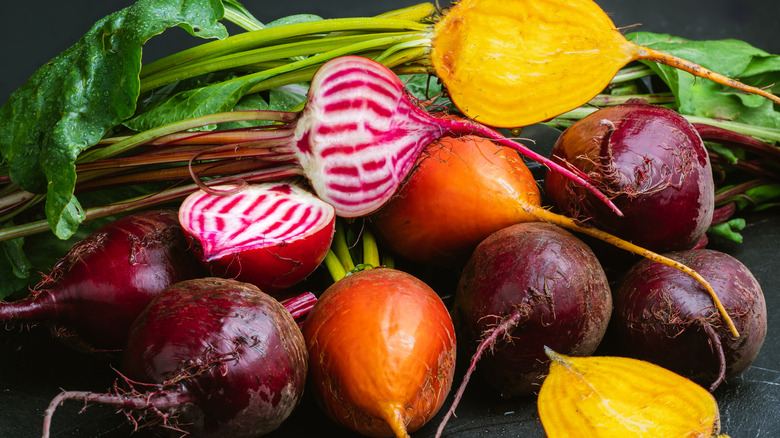 a variety of fresh beets in diferent colors