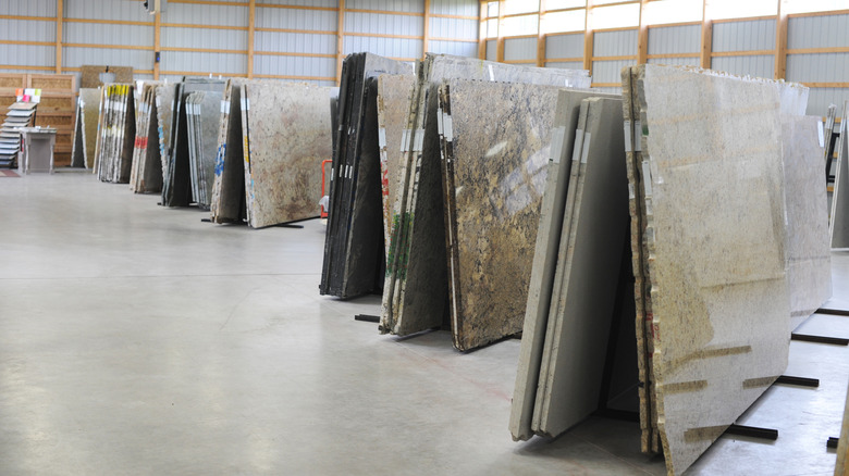 Large slabs of granite and other stone displayed in a countertop showroom