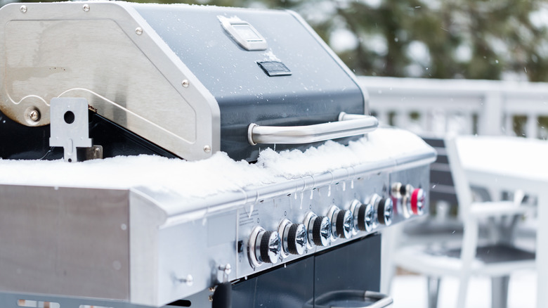 Gas grill covered in snow