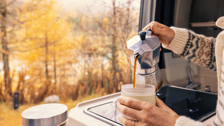 Woman pouring from moka pot