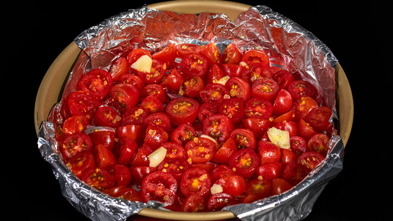 tomatoes in a foil lined dish