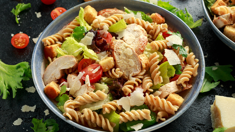 Caesar pasta salad with chicken and tomatoes 