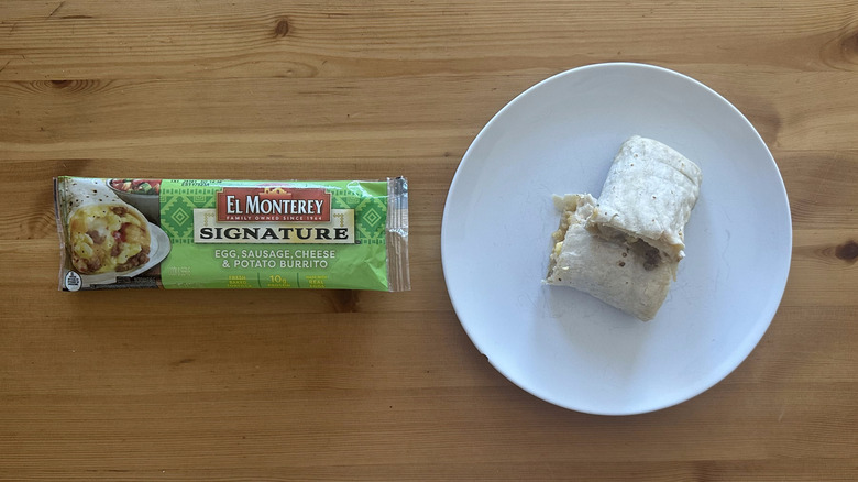 El Monterey Egg, Sausage, Cheese, and Potato Burrito on white plate on table