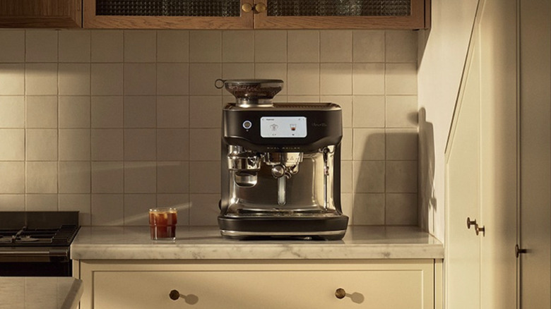 A Breville espresso machine on a kitchen counter