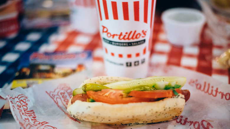 Portillo's hot dog and drink at a table