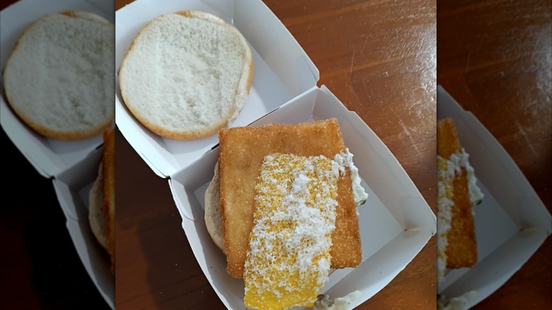 Open Filet-O-Fish showing a fish patty and a half slice of cheese.