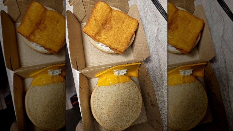 Open Filet-O-Fish showing a fish patty and a slice of cheese that's not on the bun.