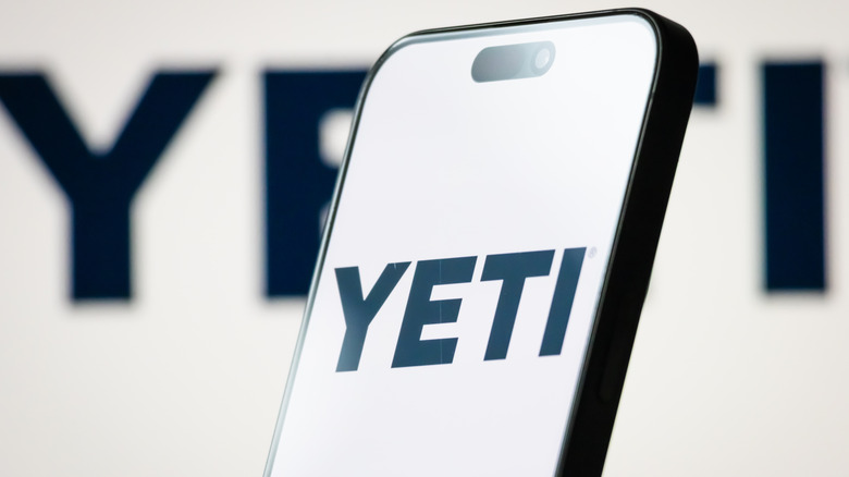 A phone displaying the Yeti logo