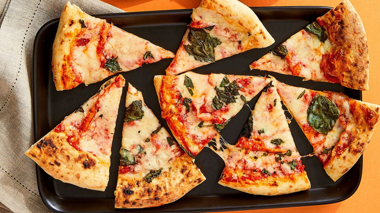 Bettergoods Italian Wood-Fired Margherita Pizza cooked and served on black baking pan
