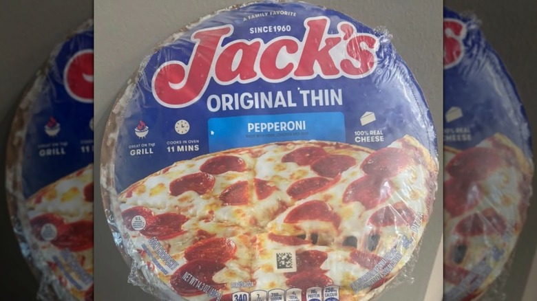 A Jack's frozen Original Thin Pepperoni pizza on a plain gray background