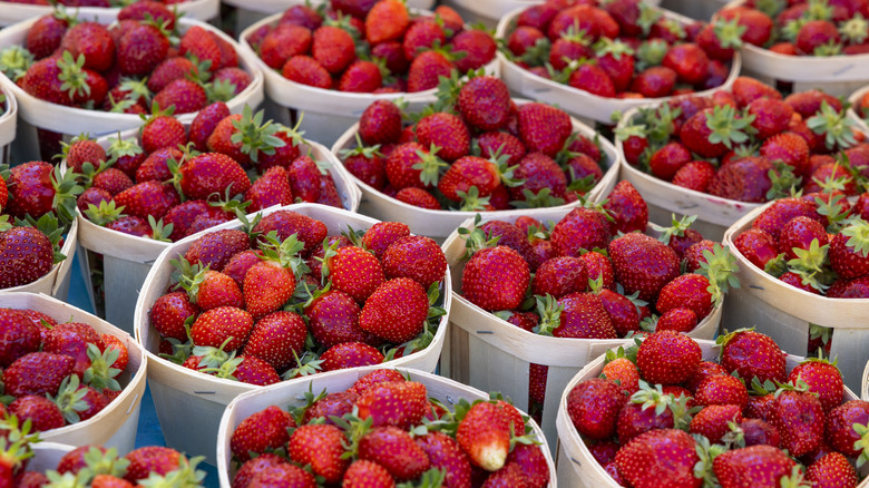 strawberries in baskets at farmers market