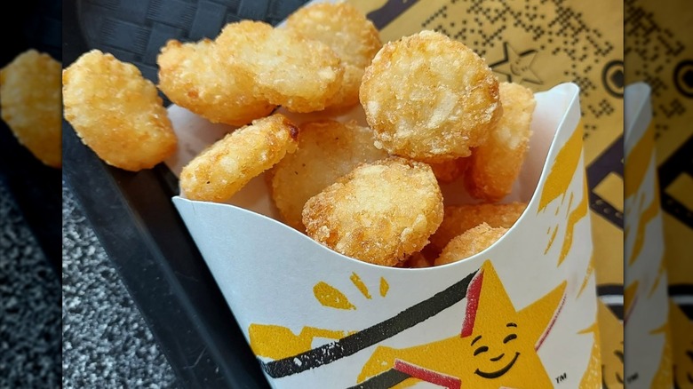 A cardboard container of crispy-looking Hash Rounds from Hardee's.
