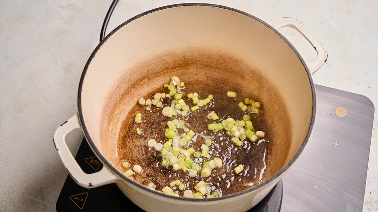 cooking scallions in a pot