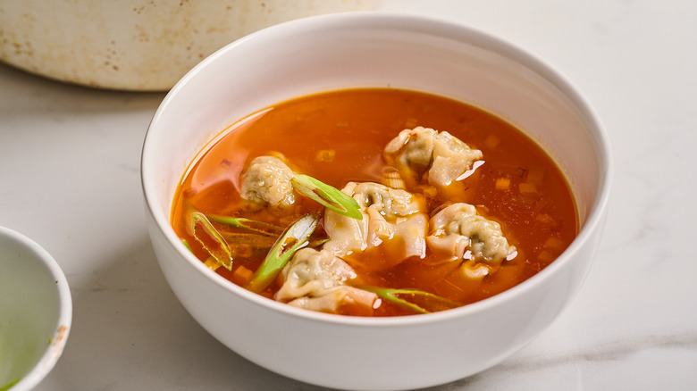 wonton soup with scallion garnish