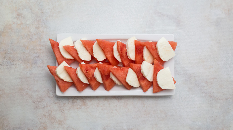 watermelon and mozzarella lined up on serving platter