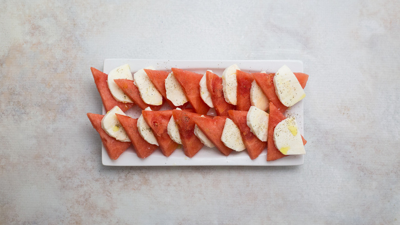 watermelon and mozzarella salad on white dish