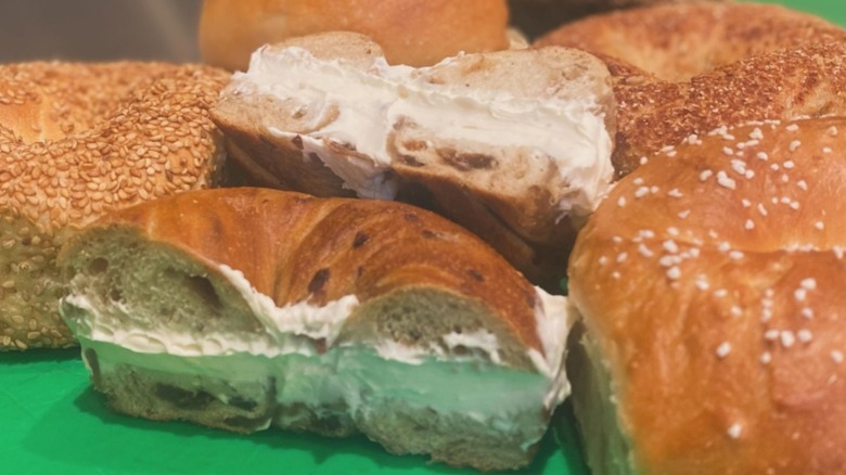 Close-up of whole and halved bagels