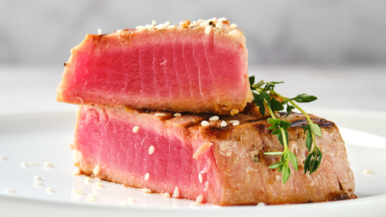 A beautifully seared ahi tuna steak with pink interior