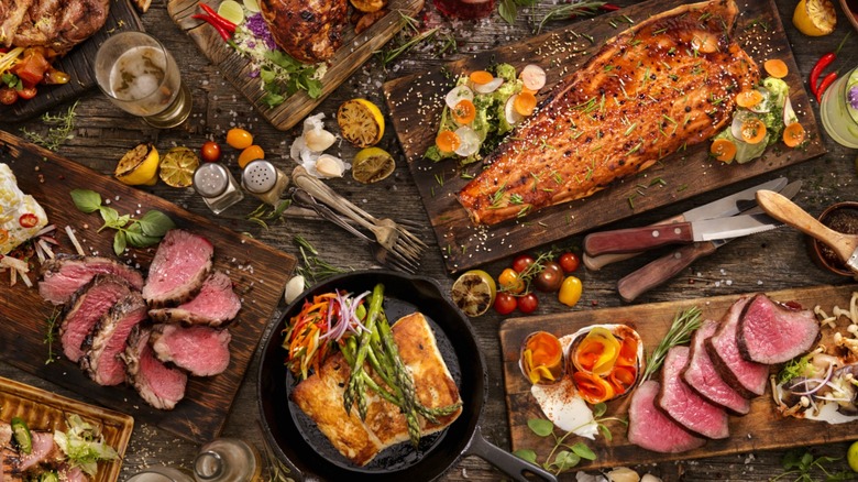 A table full of a range of different cooked meats