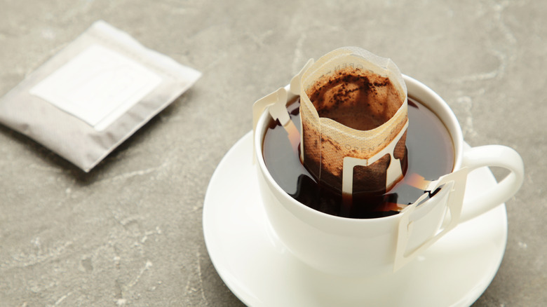 drip coffee bag in white cup