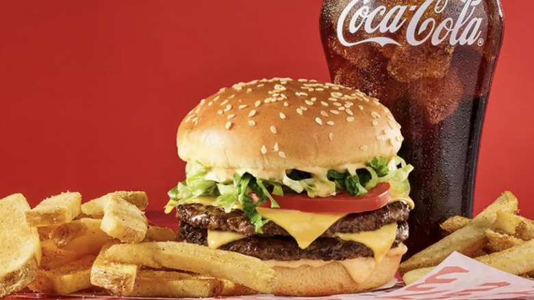 A Red Robin Haystack Double Burger with fries and a glass of Coca Cola
