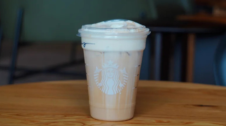 Starbucks Iced Banana Bread Latte on wooden table