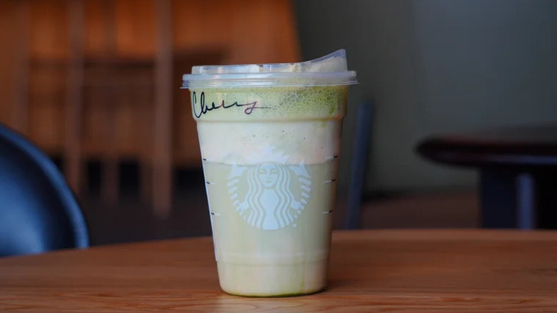 Starbucks Iced Pumpkin Cream Matcha on wooden table