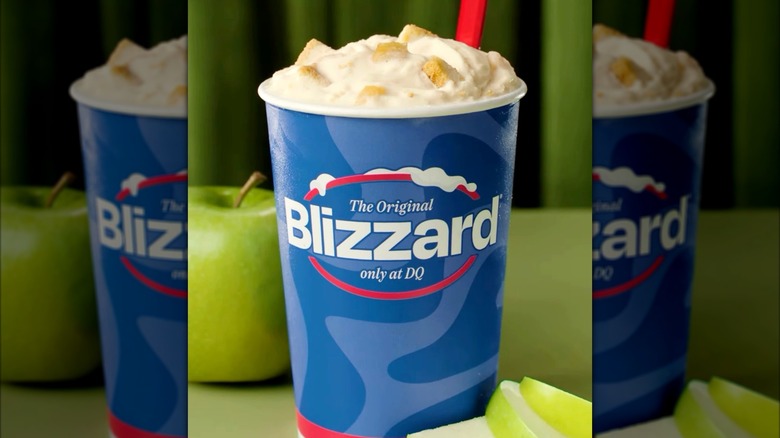 A Dairy Queen Caramel Apple Cheesecake Blizzard dessert with a green apple