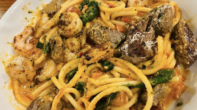 close up of a bowl of Calabrian Steak & Shrimp Bucatini from Olive Garden