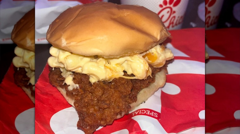 A Chick-fil-A Chicken Sandwich topped with a side of mac and cheese