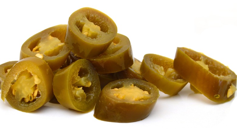 Close up image of pickled jalapeños.