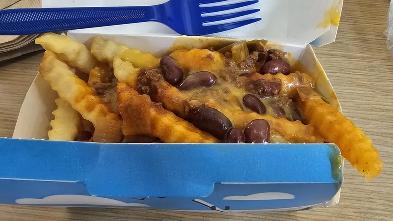 An order of Culver's chili cheddar fries sits on a table