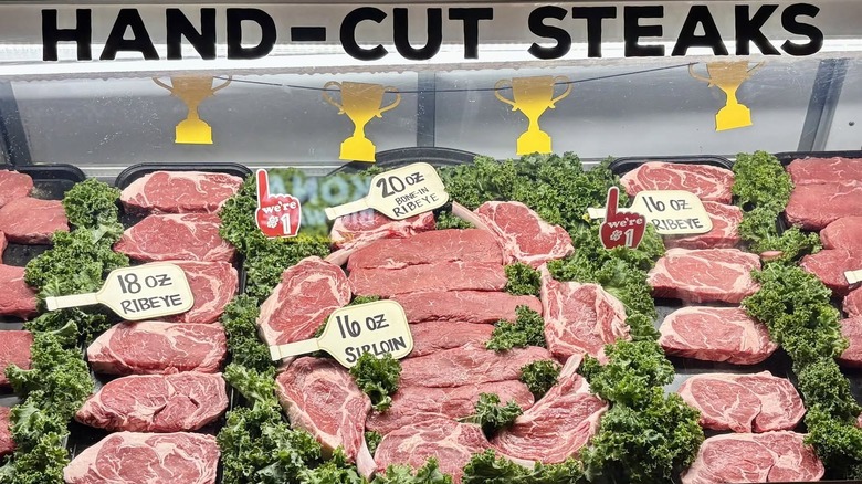 A display case at Texas Roadhouse shows different cuts of steak