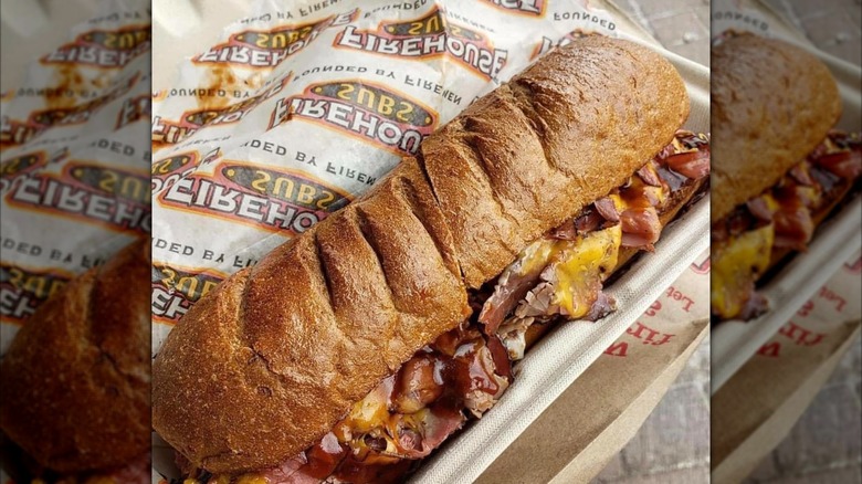 Smokehouse Beef & Cheddar Brisket in container with paper