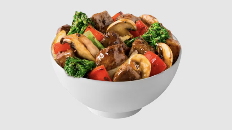 Black Pepper Sirloin Steak in a white bowl on white background
