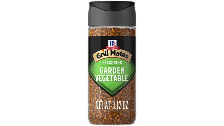 A container of McCormick Grill Mates Garden Vegetable seasoning on white background