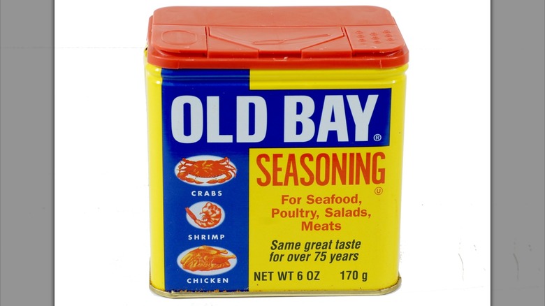 A tin of Old Bay seasoning on white background