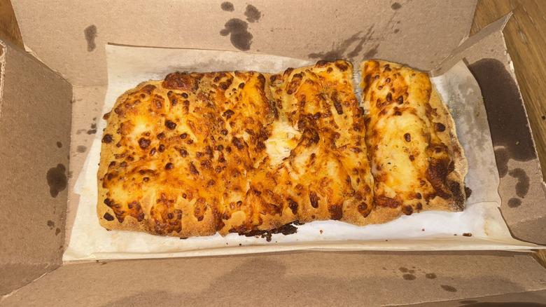 Domino's Stuffed Cheesy Bread in a cardboard box.