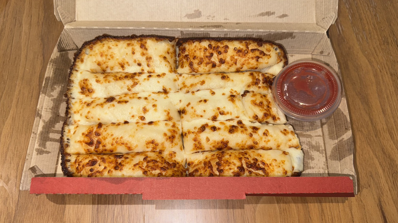 Pizza Hut Cheesesticks in a cardboard box.